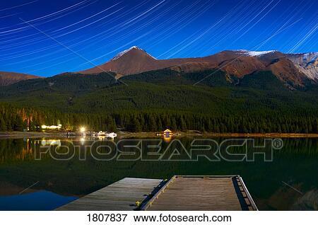 Starry night of mountains and lake, Maligne Lake, Jasper National Park, Alberta, Canada View Large Photo Image Stock Photo - Starry night of mountains and lake, Maligne Lake, Jasper National Park, Alberta, Canada. Fotosearch