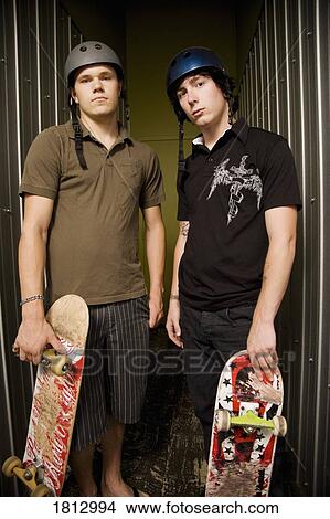 Two guys with skateboards View Large Photo Image Picture - Two guys with skateboards. Fotosearch