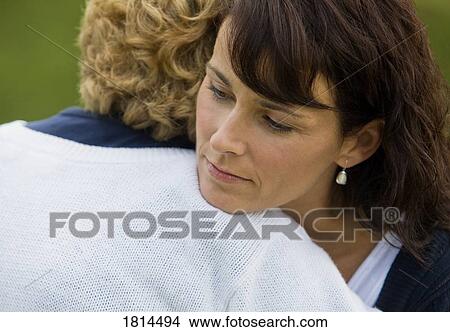 Two women hugging View Large Photo Image Picture - Two women hugging. Fotosearch
