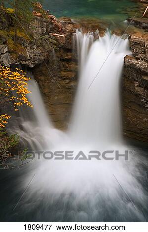 Waterfall at Johnston Canyon, Banff National Park, Alberta, Canada View Large Photo Image Stock Photo - Waterfall at Johnston Canyon, Banff National Park, Alberta, Canada. Fotosearch