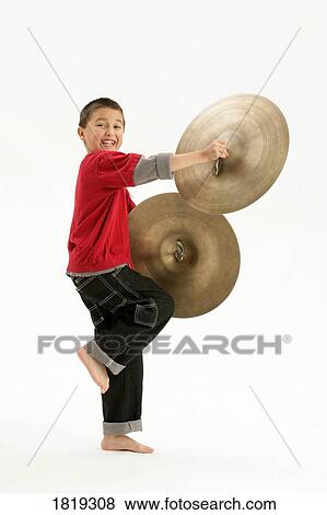 A boy holding cymbals View Large Photo Image Stock Photo - A boy holding cymbals. Fotosearch
