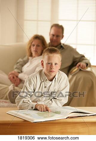 A boy with a school book View Large Photo Image Stock Photograph - A boy with a school book. Fotosearch