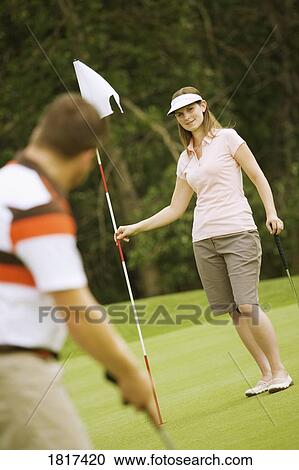 A couple golfing View Large Photo Image Stock Image - A couple golfing. Fotosearch
