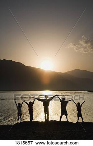 A group of people raising their hands View Large Photo Image Stock Photo - A group of people raising their hands. Fotosearch