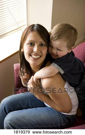 Stock Photo - A mother playing with her son. Fotosearch