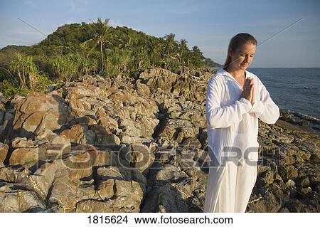 Picture - A woman meditating. Fotosearch