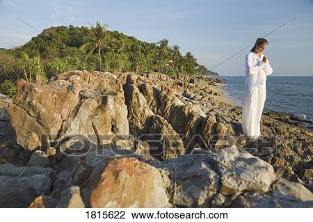 Stock Image - A woman meditating. Fotosearch