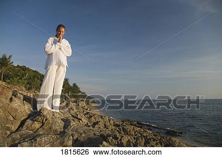 A woman meditating View Large Photo Image Stock Photograph - A woman meditating. Fotosearch