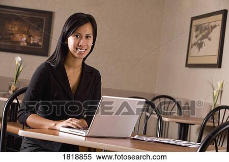 A woman with a laptop View Large Photo Image Stock Photography - A woman with a laptop. Fotosearch
