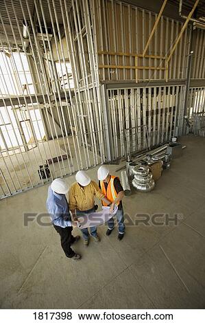 Stock Photo - Architects consulting. Fotosearch