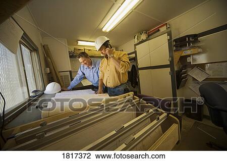 Stock Image - Architects hard at work. Fotosearch