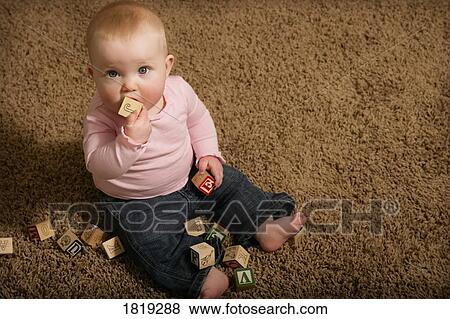 Stock Photo - Baby playing with ABC blocks. Fotosearch