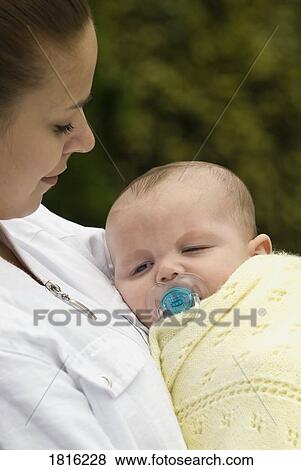 Baby with mother  View Large Photo Image Stock Photo - Baby with mother . Fotosearch