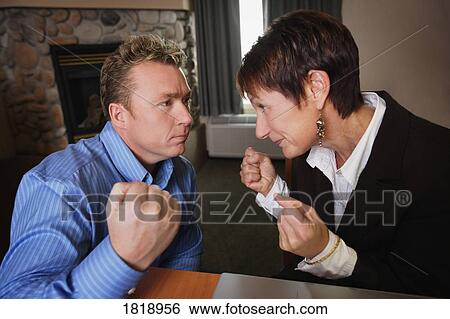 Stock Photograph - Battle of the sexes. Fotosearch