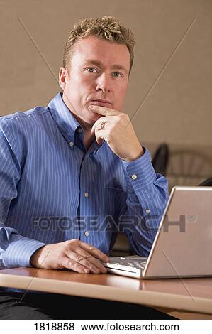 Businessman with laptop computer View Large Photo Image Stock Photo - Businessman with laptop computer. Fotosearch