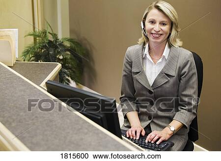 Businesswoman on computer and phone View Large Photo Image Stock Image - Businesswoman on computer and phone. Fotosearch