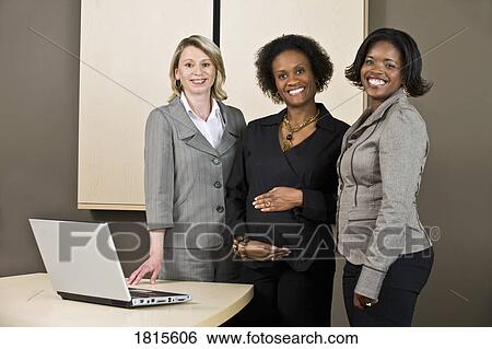 Stock Photograph - Businesswomen at work. Fotosearch