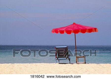 Chair and umbrella on tropical beach in Phuket, Thailand View Large Photo Image Stock Image - Chair and umbrella on tropical beach in Phuket, Thailand . Fotosearch
