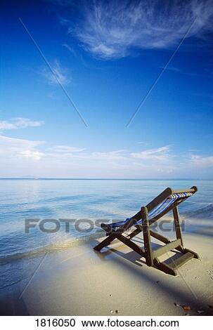 Chair on tropical beach in Ko Phi Phi Don island, Thailand View Large Photo Image Stock Image - Chair on tropical beach in Ko Phi Phi Don island, Thailand . Fotosearch