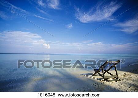 Stock Photo - Chair on tropical beach in Ko Phi Phi Don island, Thailand . Fotosearch