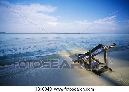 Chair on tropical beach in Ko Phi Phi Don island, Thailand View Large Photo Image Stock Photo - Chair on tropical beach in Ko Phi Phi Don island, Thailand . Fotosearch