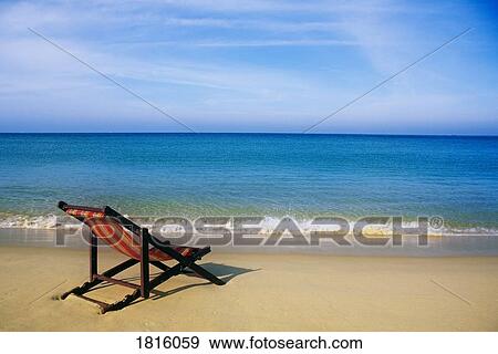 Stock Photo - Chair on tropical beach in Ko Phi Phi Don island, Thailand . Fotosearch