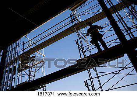Construction worker on scaffolding View Large Photo Image Stock Image - Construction worker on scaffolding. Fotosearch