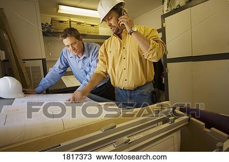 Stock Image - Construction workers together. Fotosearch