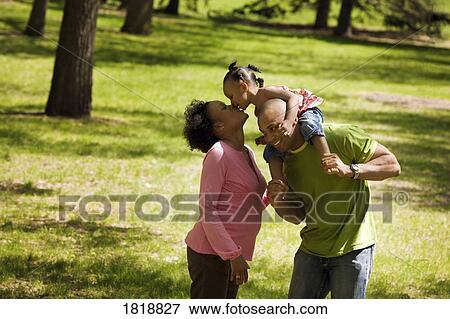 Family in the park View Large Photo Image Stock Photo - Family in the park. Fotosearch