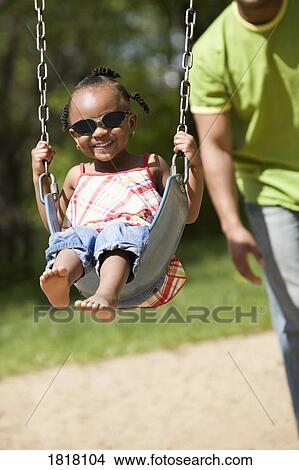 Picture - Girl on a swing. Fotosearch