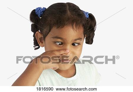Girl touching her nose and crossing her eyes View Large Photo Image Stock Image - Girl touching her nose and crossing her eyes. Fotosearch