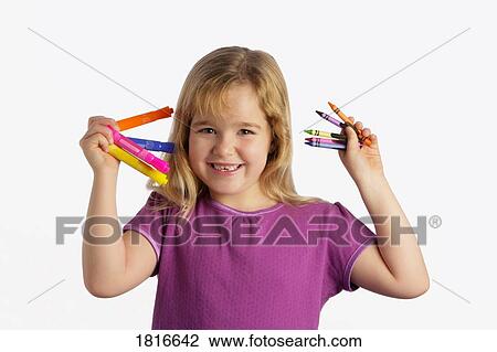 Stock Image - Girl with crayons and markers. Fotosearch
