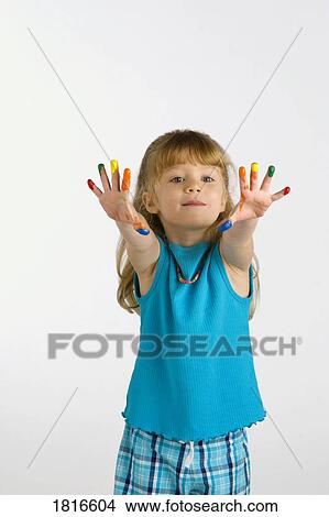 Picture - Girl with paint on her fingers. Fotosearch