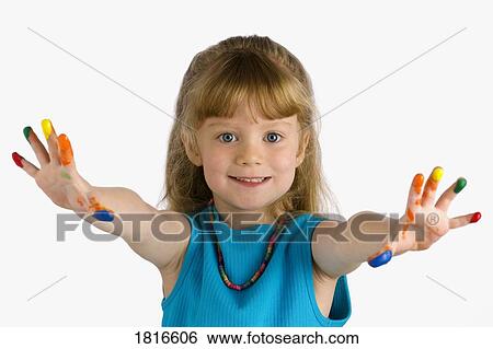 Stock Photograph - Girl with paint on her fingers. Fotosearch