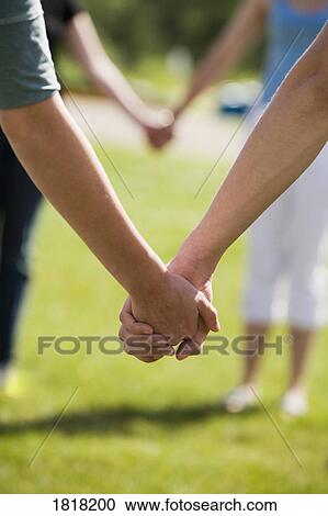 Holding hands View Large Photo Image Stock Image - Holding hands. Fotosearch