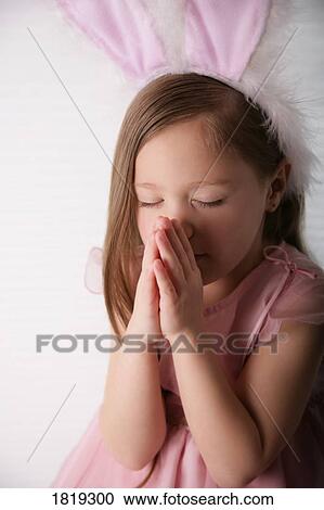 Little Easter Bunny saying a prayer View Large Photo Image Stock Image - Little Easter Bunny saying a prayer . Fotosearch