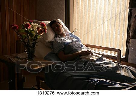 Man in a hospital bed View Large Photo Image Stock Photograph - Man in a hospital bed. Fotosearch