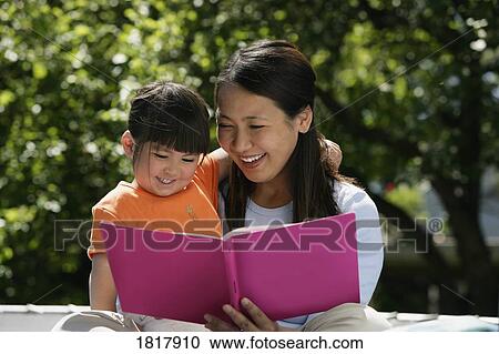 Mother and child reading View Large Photo Image Stock Image - Mother and child reading. Fotosearch