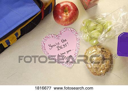 Stock Photo - Mother's love note with lunch bag. Fotosearch