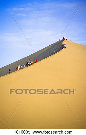 People on sand dune View Large Photo Image Stock Photography - People on sand dune. Fotosearch