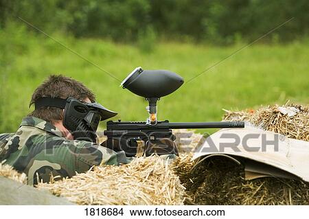 Person playing paintball View Large Photo Image Picture - Person playing paintball. Fotosearch
