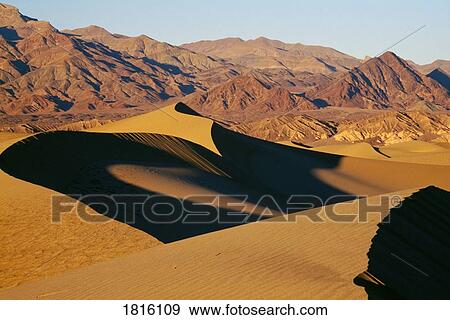 Stock Photo - Sand dunes and mountains, Death Valley National Park, California, USA. Fotosearch