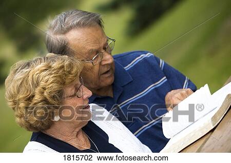 Senior couple reading the Bible View Large Photo Image Stock Image - Senior couple reading the Bible. Fotosearch