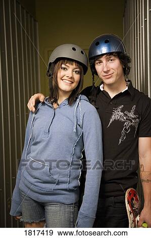 Skateboarding couple View Large Photo Image Stock Photo - Skateboarding couple. Fotosearch