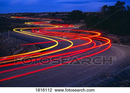Stock Image - Streaking car lights on road, Utah, USA . Fotosearch