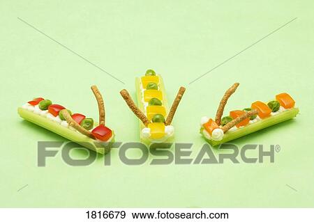 Studio shot of food decorated like caterpillars View Large Photo Image Stock Photo - Studio shot of food decorated like caterpillars. Fotosearch