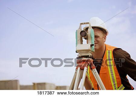 Surveyor at work View Large Photo Image Stock Photo - Surveyor at work. Fotosearch
