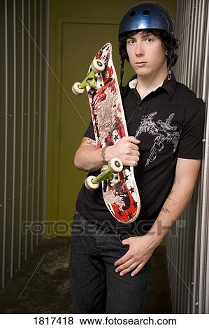 Teenage boy with skateboard View Large Photo Image Stock Photo - Teenage boy with skateboard. Fotosearch