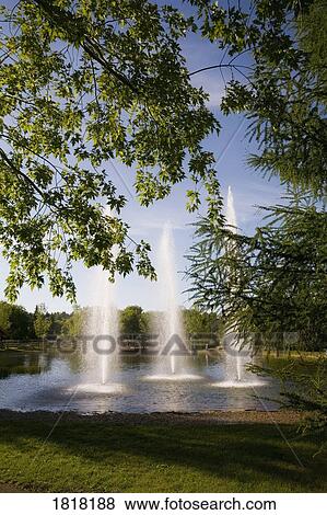 Three fountains in a park View Large Photo Image Stock Photo - Three fountains in a park. Fotosearch
