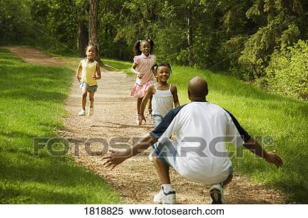 Three girls running to their dad View Large Photo Image Stock Photography - Three girls running to their dad. Fotosearch